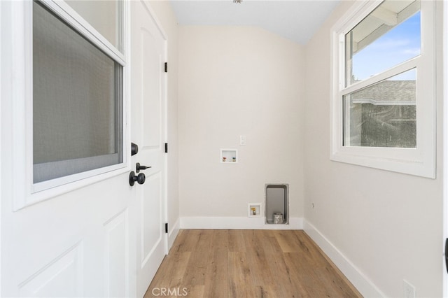 laundry room with hookup for a washing machine and light wood-type flooring