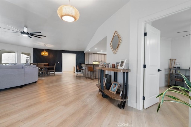 living room featuring ceiling fan and light hardwood / wood-style floors