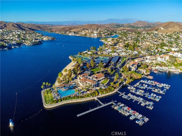 drone / aerial view featuring a water and mountain view