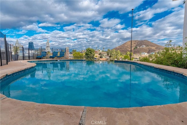 view of pool with a mountain view