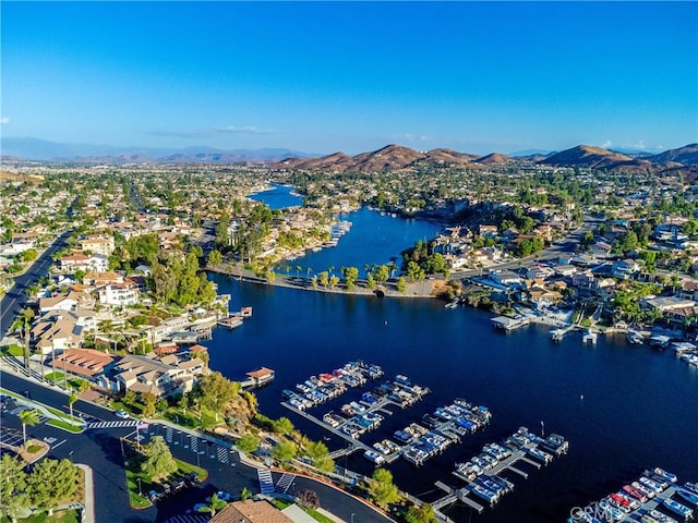 aerial view featuring a water and mountain view