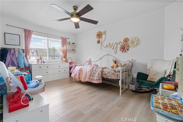 bedroom with ceiling fan and light wood-type flooring