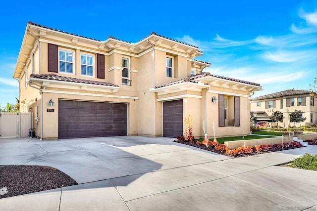 mediterranean / spanish house with a garage