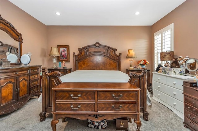 bedroom with light colored carpet