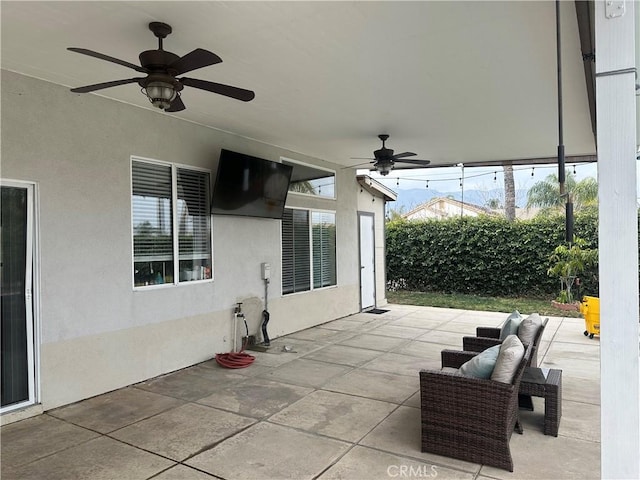 view of patio with ceiling fan