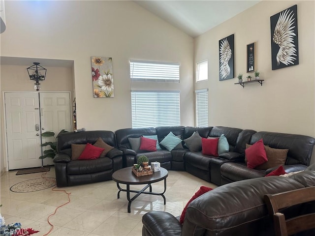 tiled living room with high vaulted ceiling