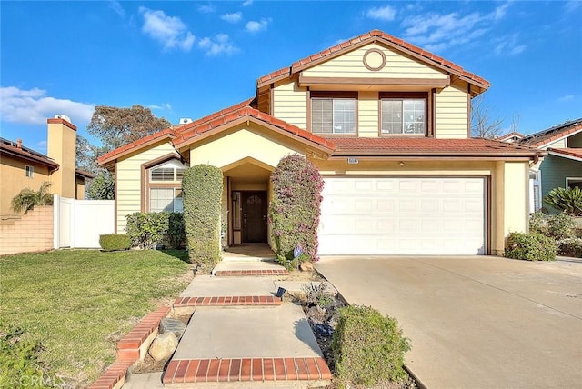 view of front of home featuring a garage and a front yard