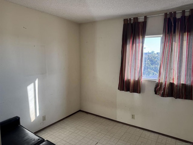 empty room with a textured ceiling