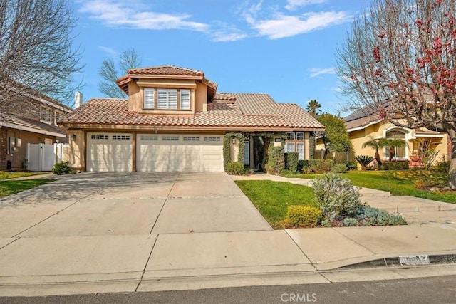 mediterranean / spanish house with a front yard