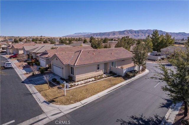 birds eye view of property featuring a mountain view