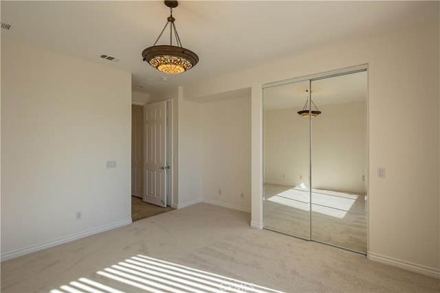 unfurnished bedroom with carpet flooring