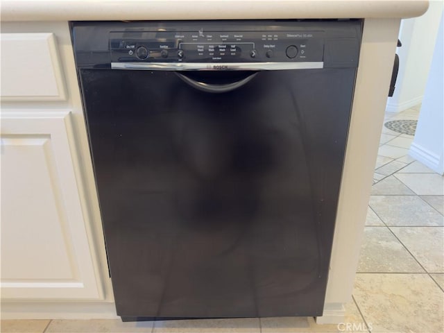 interior details with white cabinetry and dishwasher