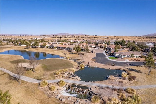 birds eye view of property featuring a water and mountain view