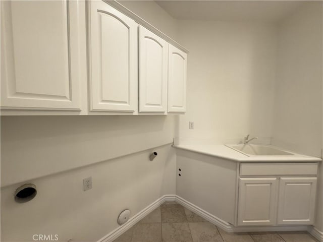 laundry area with cabinets, sink, and electric dryer hookup