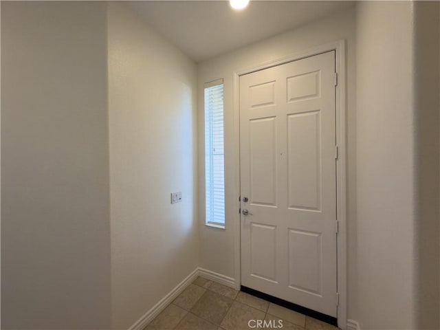 entryway with light tile patterned floors