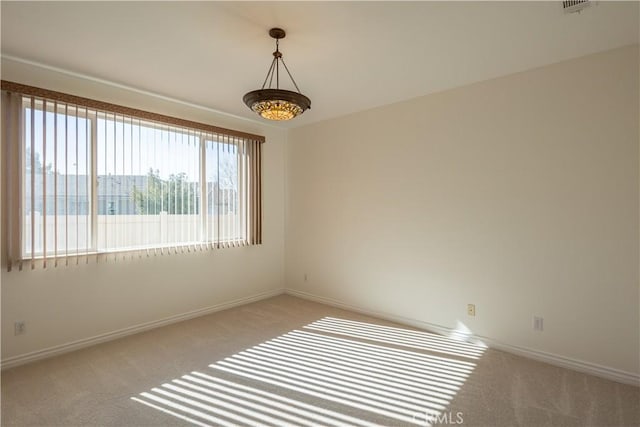 empty room with light colored carpet