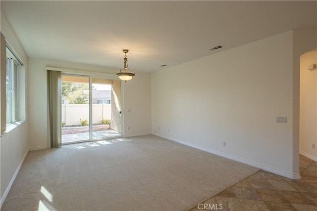 unfurnished room with light carpet