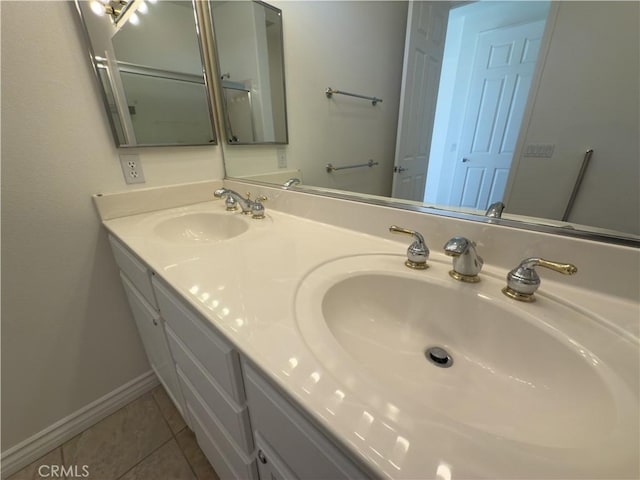 bathroom with tile patterned flooring and vanity