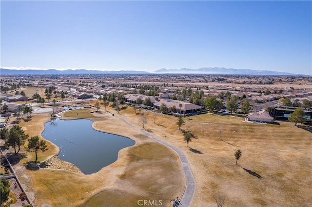 birds eye view of property featuring a water and mountain view