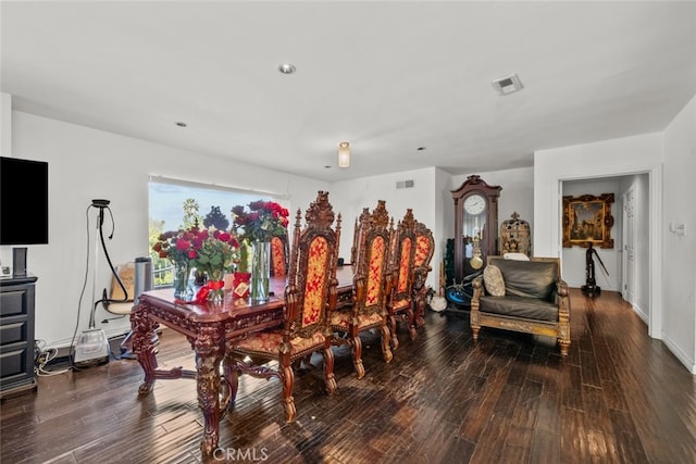 dining area with dark hardwood / wood-style floors