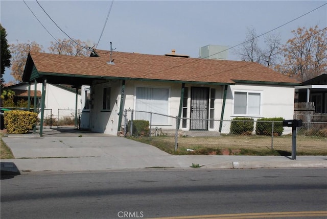 ranch-style home with a carport