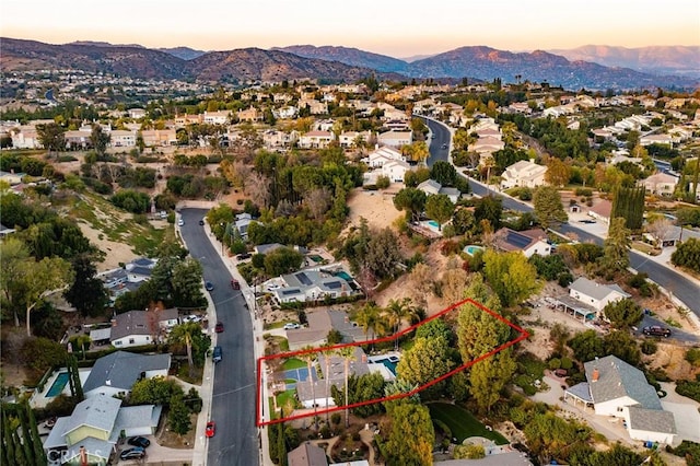 aerial view at dusk with a mountain view