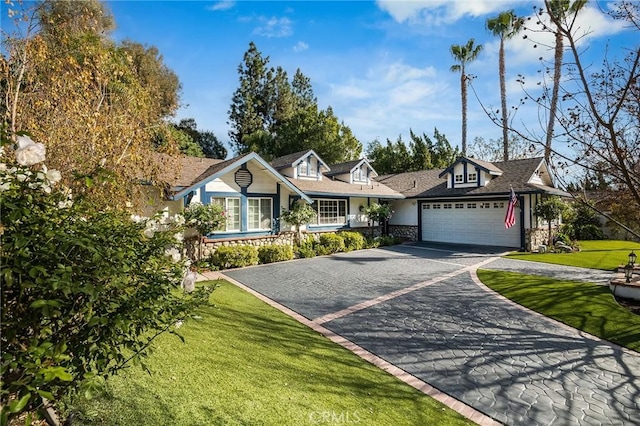 ranch-style home with a garage and a front yard