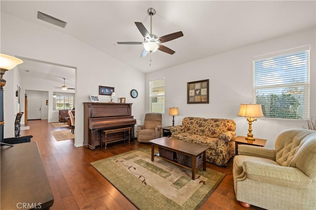 living room featuring lofted ceiling, dark hardwood / wood-style floors, and ceiling fan