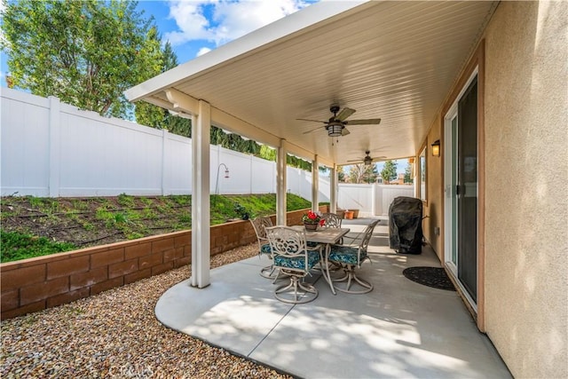 view of patio featuring area for grilling and ceiling fan