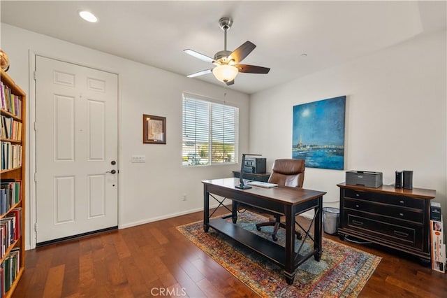 office space with dark hardwood / wood-style floors and ceiling fan