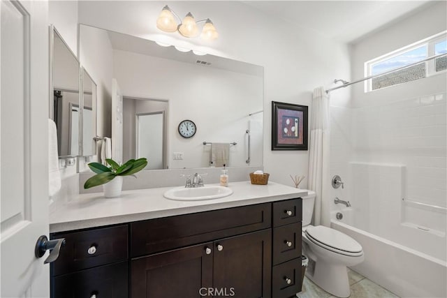 full bathroom featuring tile patterned floors, vanity, toilet, and shower / bath combo