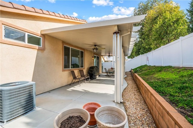 view of patio with ceiling fan and central air condition unit