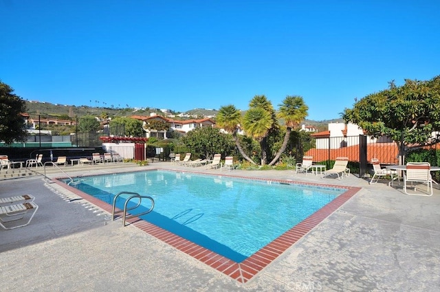 view of pool featuring a patio