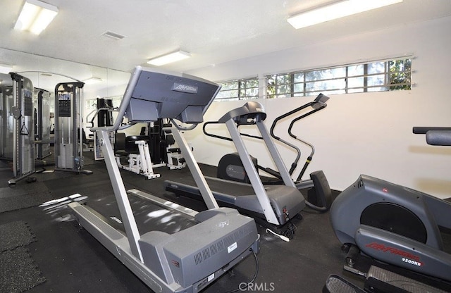 workout area with visible vents and a wealth of natural light