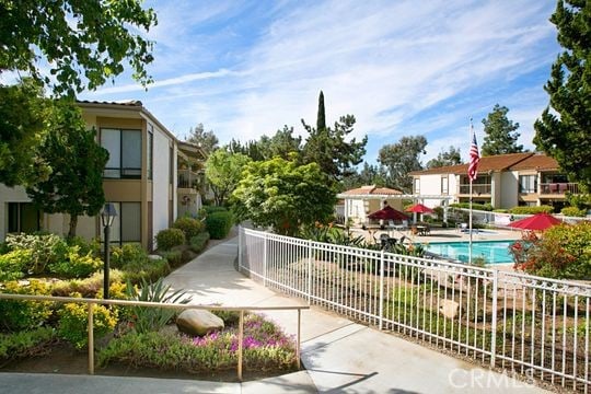 view of property's community with a swimming pool and a patio area