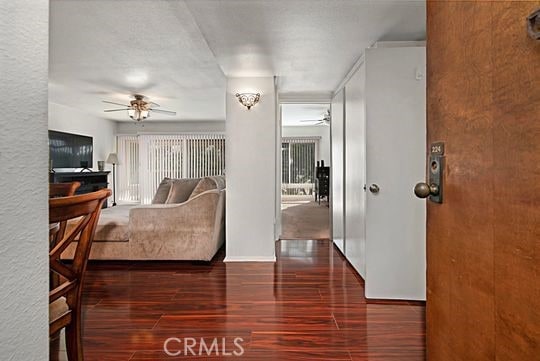 interior space featuring dark hardwood / wood-style flooring and ceiling fan