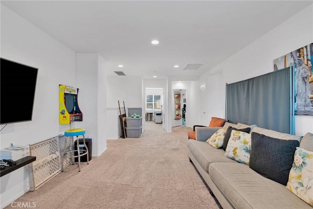 living room featuring light carpet