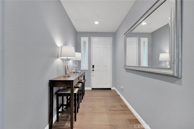 foyer entrance with light hardwood / wood-style floors