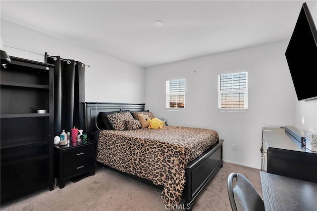 bedroom featuring light carpet