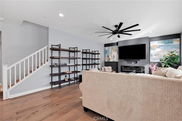 living room with ceiling fan and wood-type flooring