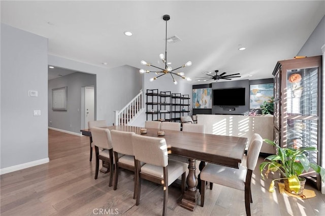 dining room featuring wood-type flooring and a chandelier