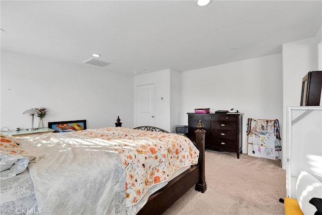 bedroom featuring light carpet