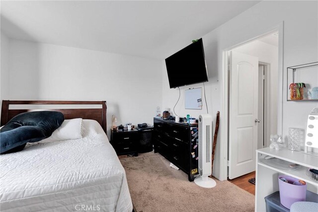 bedroom with light carpet