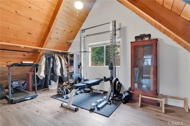 workout area with vaulted ceiling, wood-type flooring, and wooden ceiling