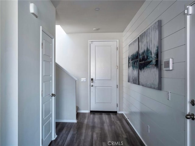 corridor with dark wood-type flooring