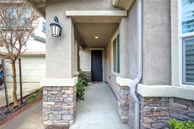 property entrance with a garage