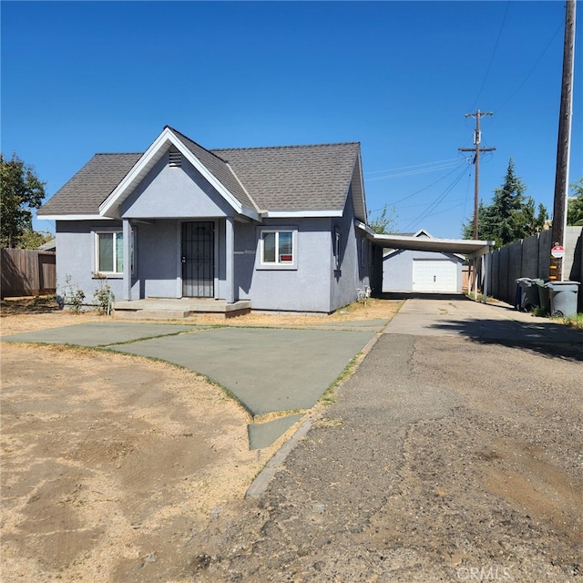 view of front of home featuring a carport