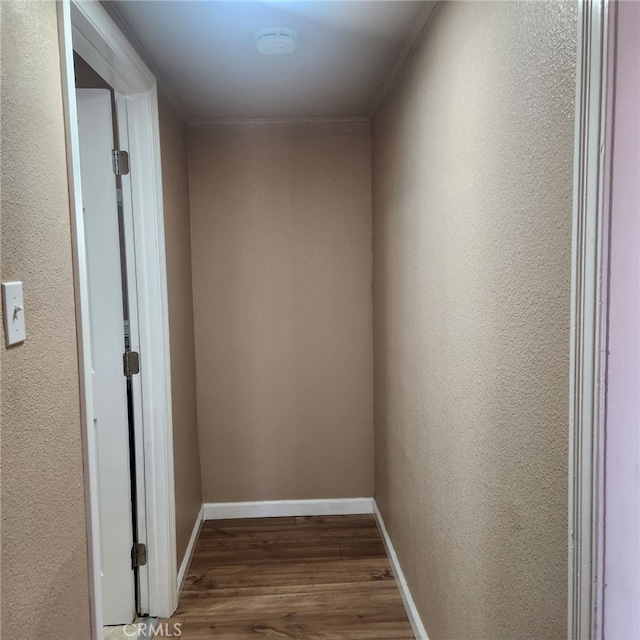 hall featuring ornamental molding and hardwood / wood-style floors