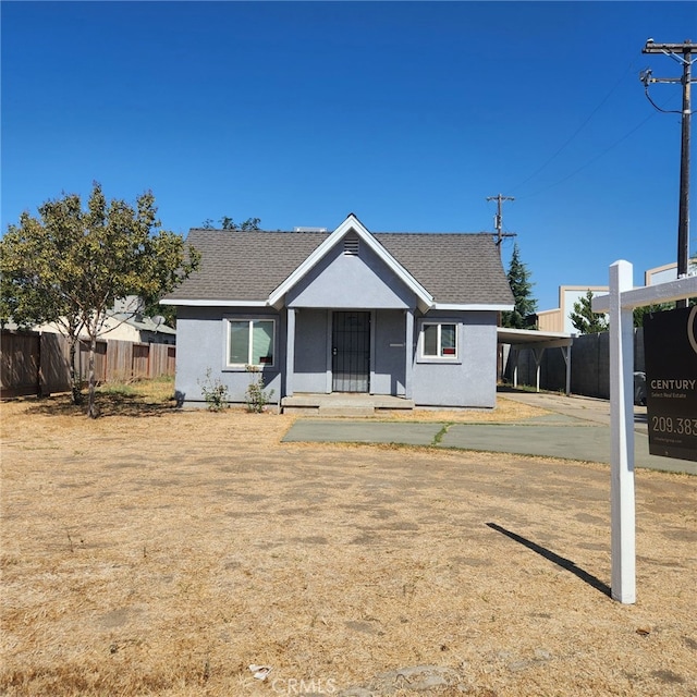 view of front of house featuring a carport