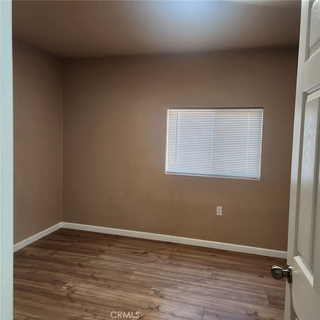 unfurnished room featuring hardwood / wood-style floors